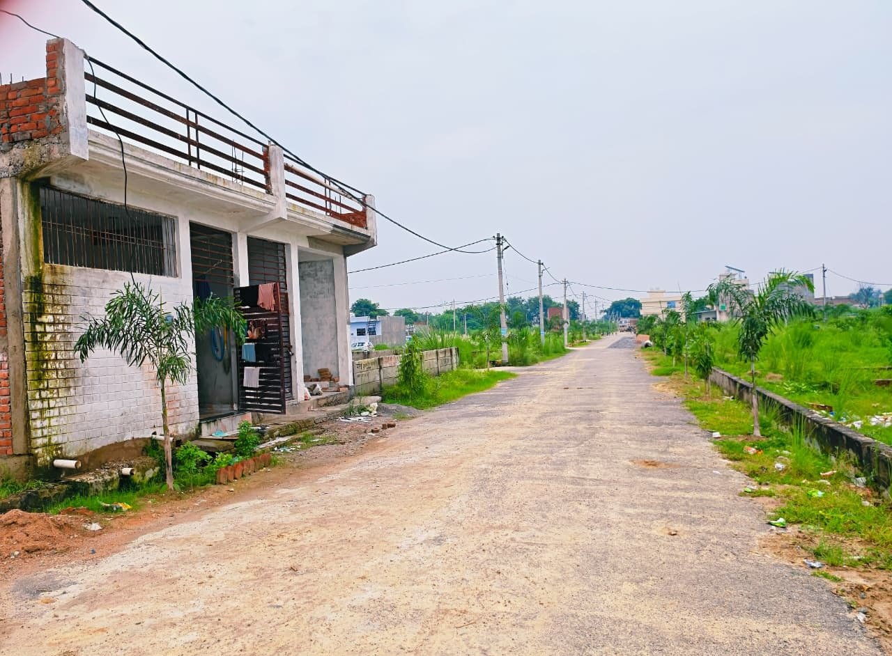 Developed asphalt road and houses at Dauwa Green City