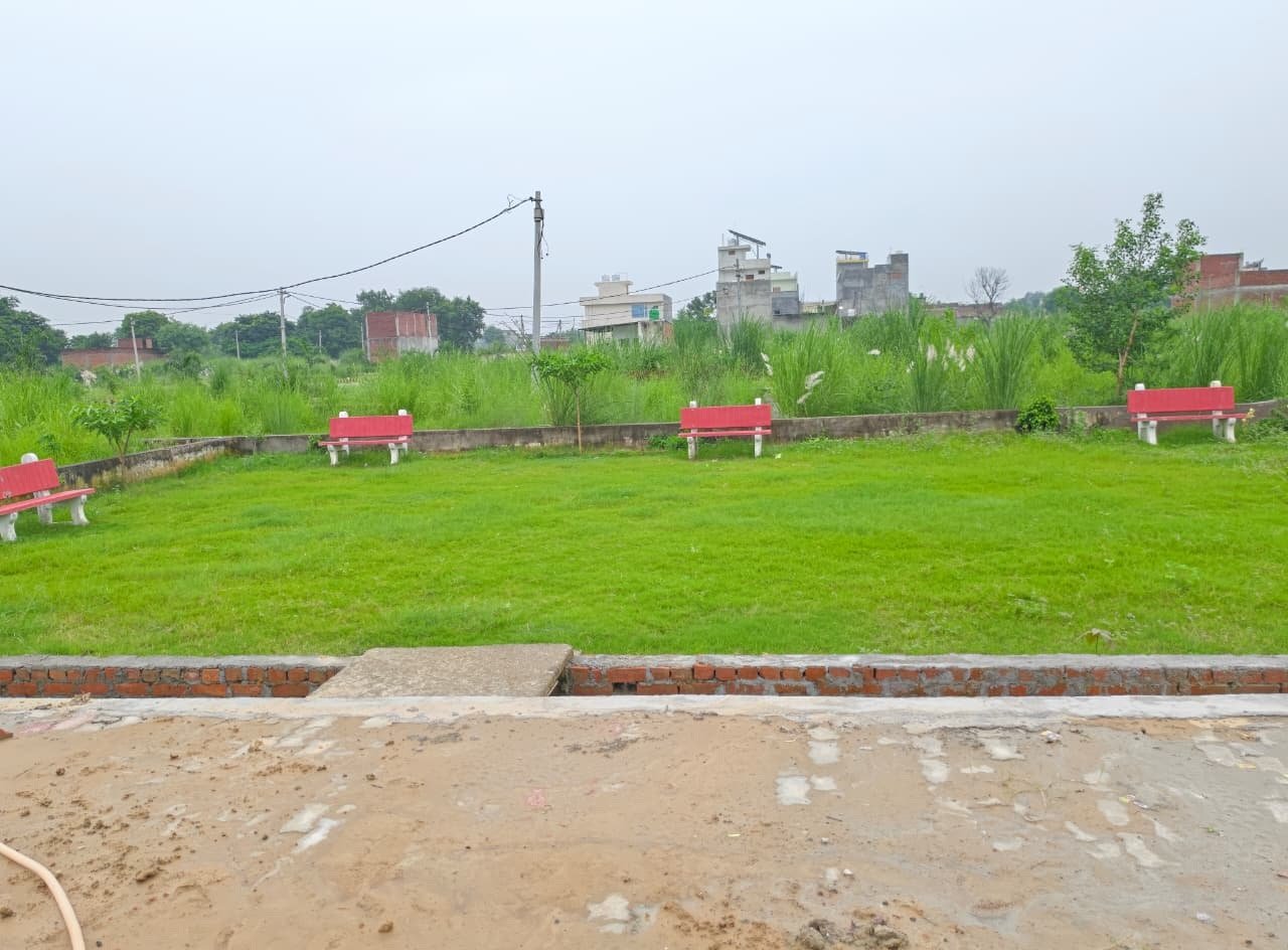Green park with sitting benches inside Dauwa Green City society